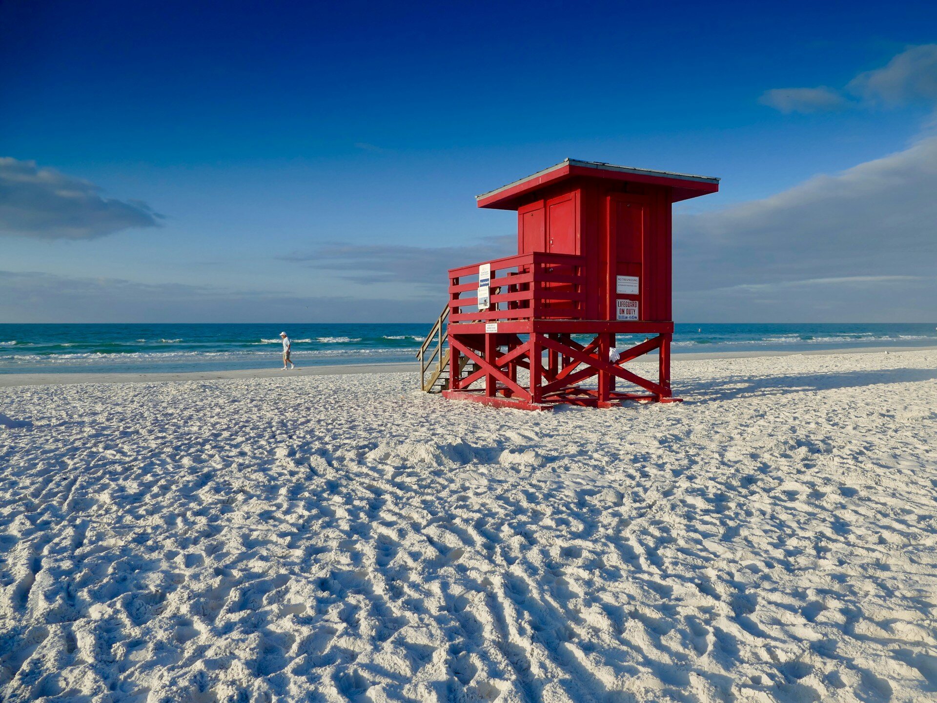The red lifeguard stand on the white sand of Siesta Key