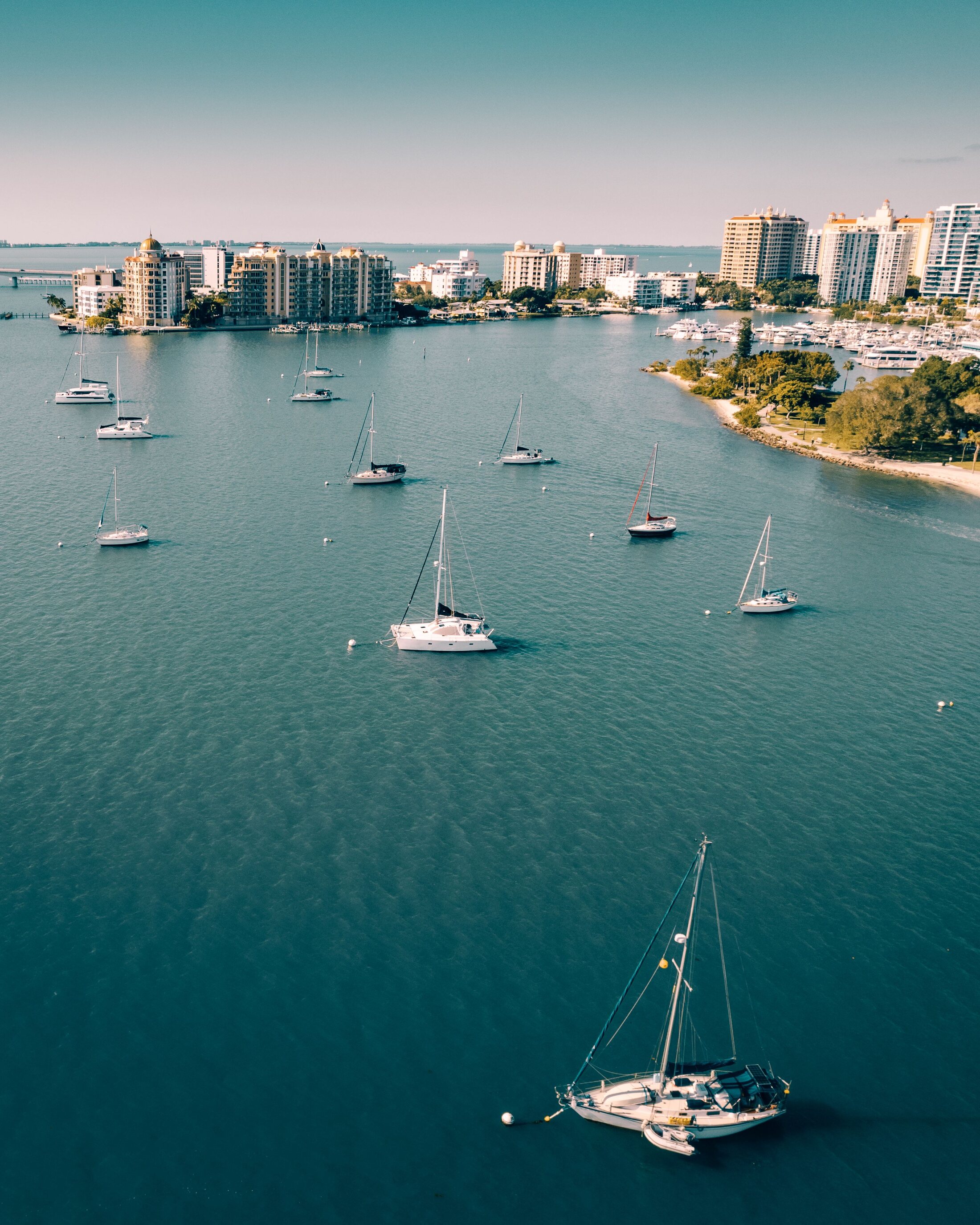 Sailboats moored on the turquoise waters of Sarasota Bay